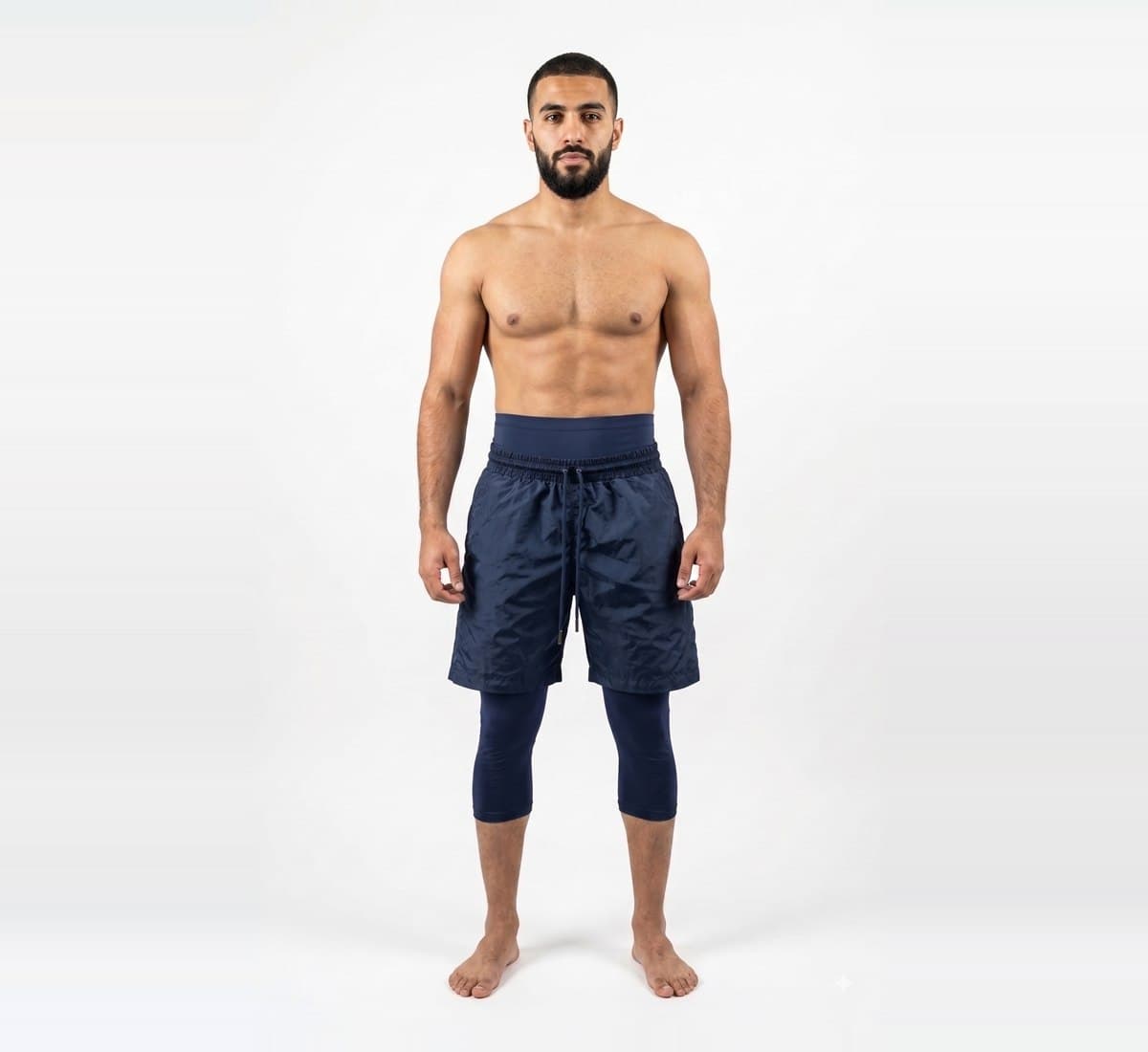 The Awrah Training Short in Navy, worn over the attached legging